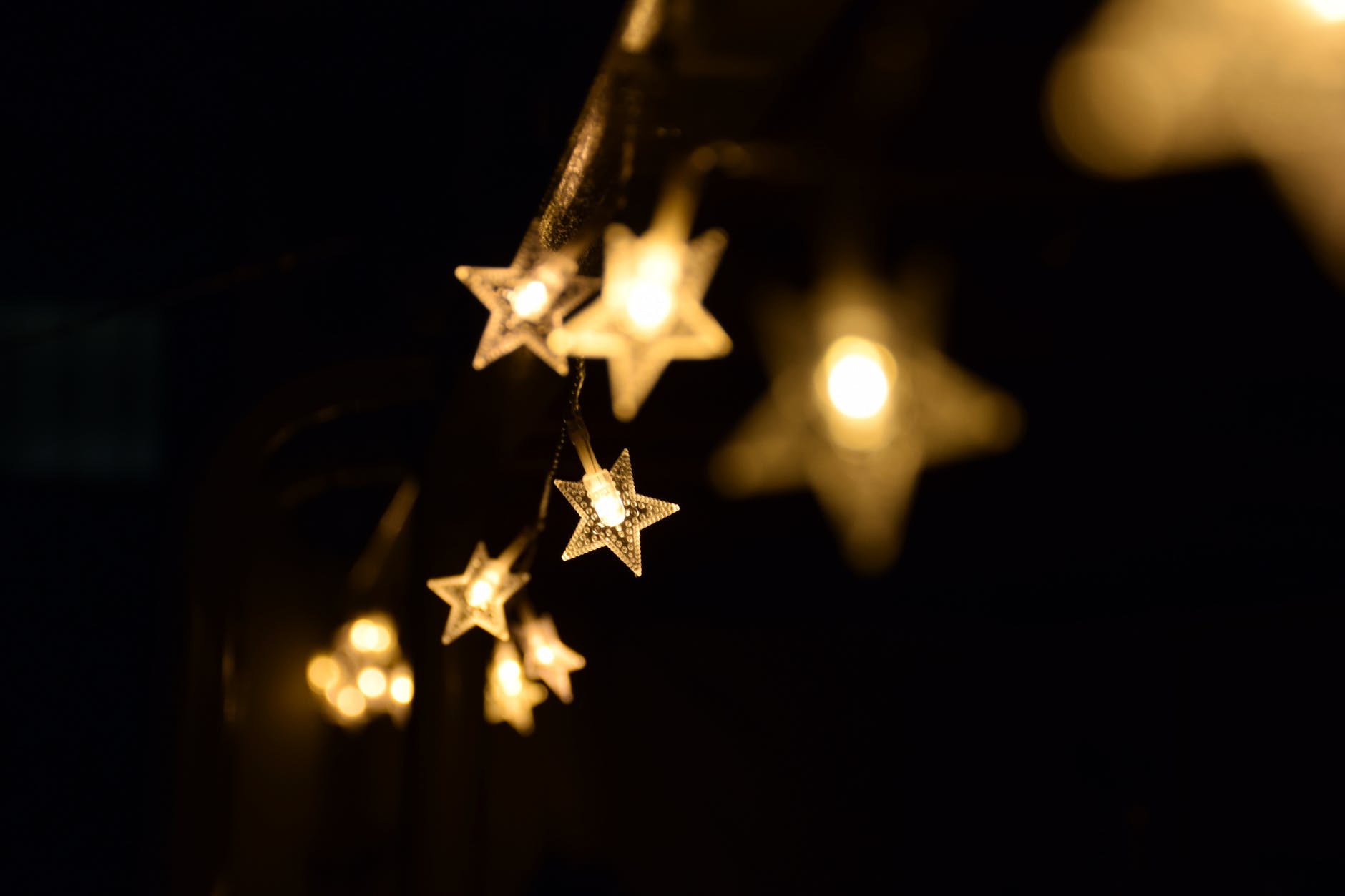 shallow focus photography of yellow star lanterns
